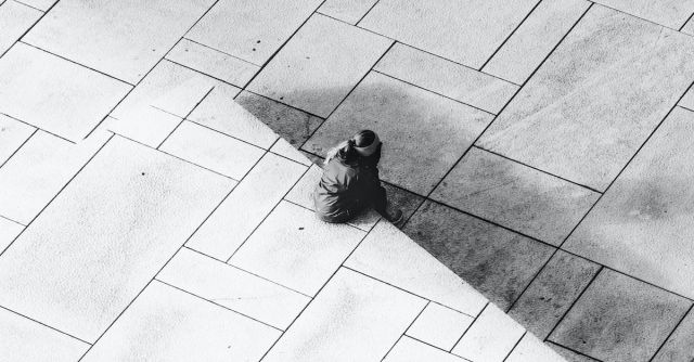Concrete Mixers - Woman Sitting on Pavement