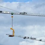 Industrial Hoist - a crane is lifting a piece of equipment into the air