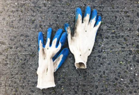Work Gloves - pair of white gloves on white surface