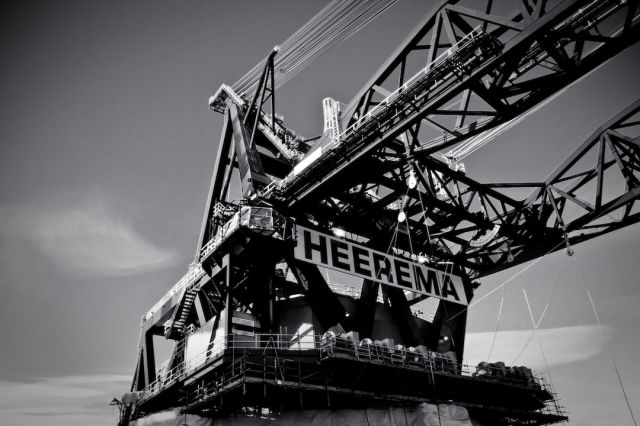 Industrial Hoist - a black and white photo of a crane