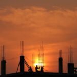 Construction Site - Silhouette of Men in Construction Site during Sunset