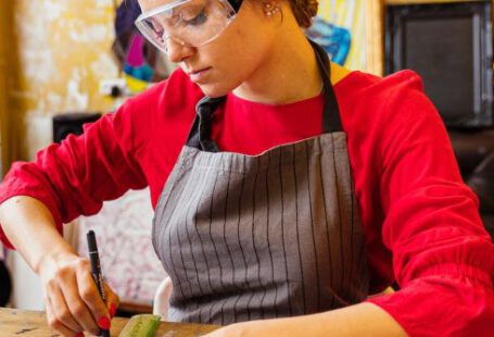 Safety Goggles - Woman Wearing Safety Goggles and Cutting Glass