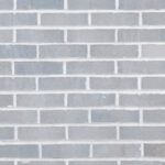 Concrete And Masonry - Full frame background of empty gray wall build with rows of brick blocks
