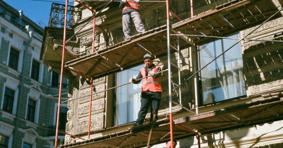 Building Industry - Men on Brown Scaffolding