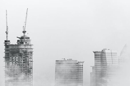 Construction - Photo of Skyscrapers Surrounded With Clouds