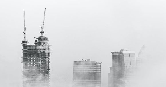 Construction - Photo of Skyscrapers Surrounded With Clouds