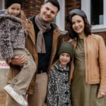 Brick House - Family Standing Near a Break House