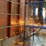 Builder - Welder working inside industrial building