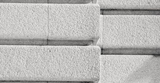 Concrete And Masonry - Corner of stone brick wall of building
