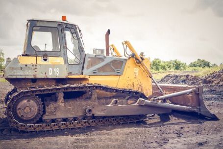 Bulldozer - Yellow and Brown Metal Pay Loader on He Dirt