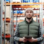Loader - Man in Bubble Jacket Holding Tablet Computer