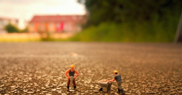Construction Workers - Selective Focus Photography of Two Men Builder Figurines