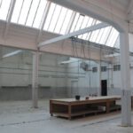 Construction Industry - Bright premise for storage with concrete floor and metal beams inside modern industrial building