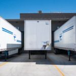 Building Industry - Three White Enclosed Trailers