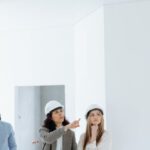 Hard Hats - Agent Talking to Her Clients