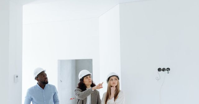 Hard Hats - Agent Talking to Her Clients