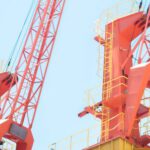 Heavy Construction Equipment - Orange Cranes