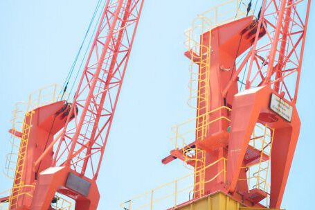 Heavy Construction Equipment - Orange Cranes