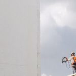 Construction - Man Walking on Roof Top