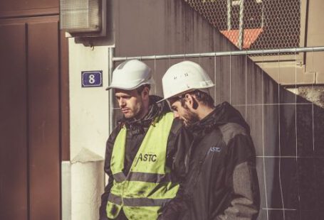 Construction Workers - Two Men Wearing White Hard Hat