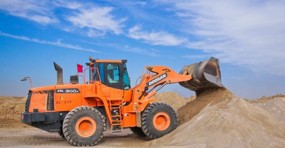 Heavy Construction Equipment - Orange Excavator on Brown Hill