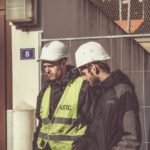 Construction Workers - Two Men Wearing White Hard Hat