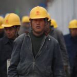 Construction Industry - Group of Persons Wearing Yellow Safety Helmet during Daytime