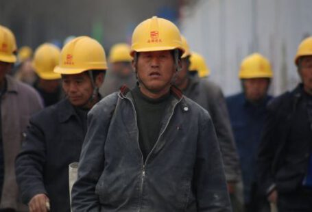 Construction Industry - Group of Persons Wearing Yellow Safety Helmet during Daytime