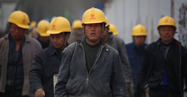 Construction Industry - Group of Persons Wearing Yellow Safety Helmet during Daytime