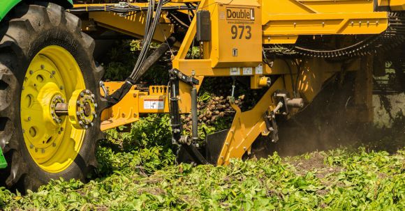 Bulldozer - Yellow Heavy Equipment on Ground with green Leaves