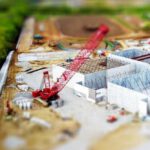 Construction - Tilt Shift Lens Photography of Red Crane Miniature