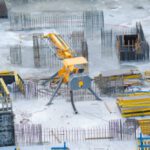 Construction - Yellow and Black Heavy Equipment on Snow Covered Ground