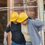 Construction Workers - A Construction Worker Helping a Colleague Walk