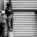 Construction Workers - Grayscale Photo of Three Men Arranging Metal Wall